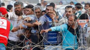 topsyrian-refugees-get-water-from-turkish-red-crescentreutersmurad-sez